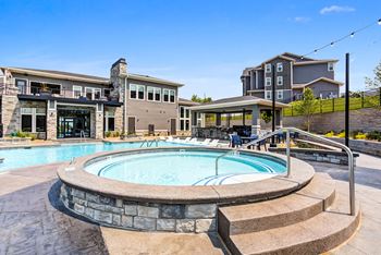 Resort style pool with spa, baja shelf & shaded cabanas